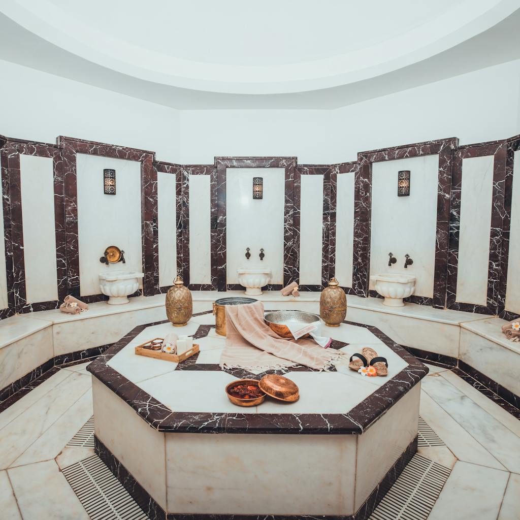 Experience relaxation in an opulent Turkish hammam spa, featuring marble decor and traditional spa elements.